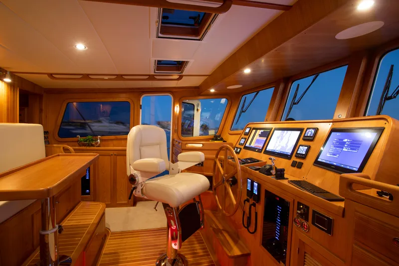 Slide: The Image of Luxurious helm station of 2025 Krogen 48 AE yacht with advanced navigation systems. - 3