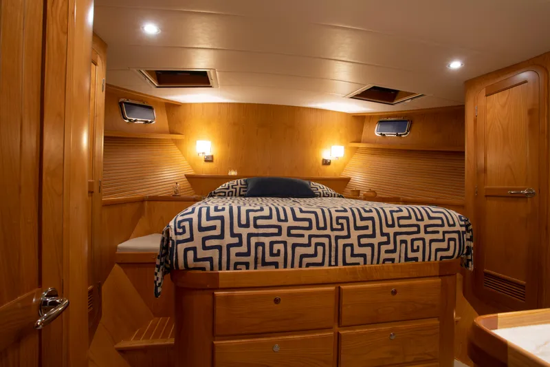 Slide: The Image of Luxurious cabin interior of 2025 Krogen 48 AE yacht with wooden furnishings. - 7