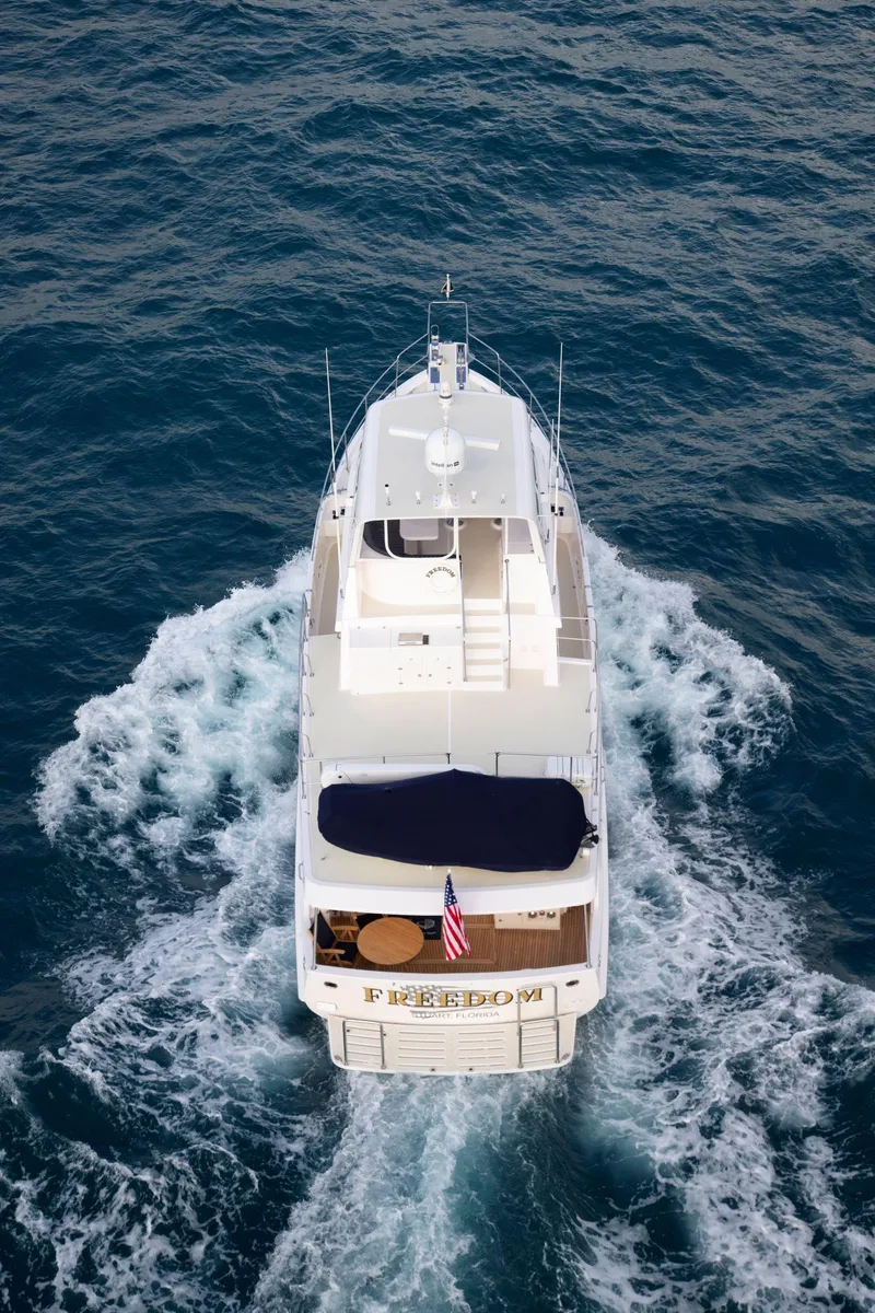 Slide: The Image of Aerial view of 2025 Krogen 58 Extended Bridge yacht cruising on open water. - 16