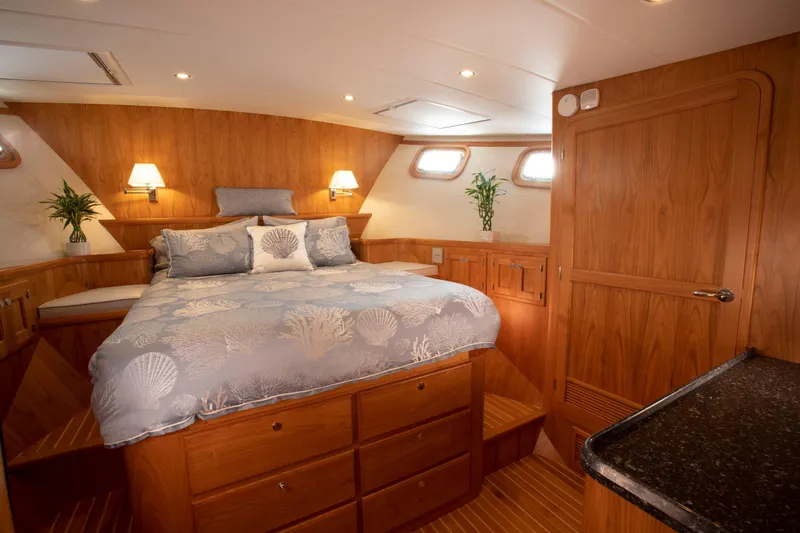 Slide: The Image of Luxurious cabin interior of 2025 Krogen 58 Extended Bridge yacht with elegant wood finish. - 27