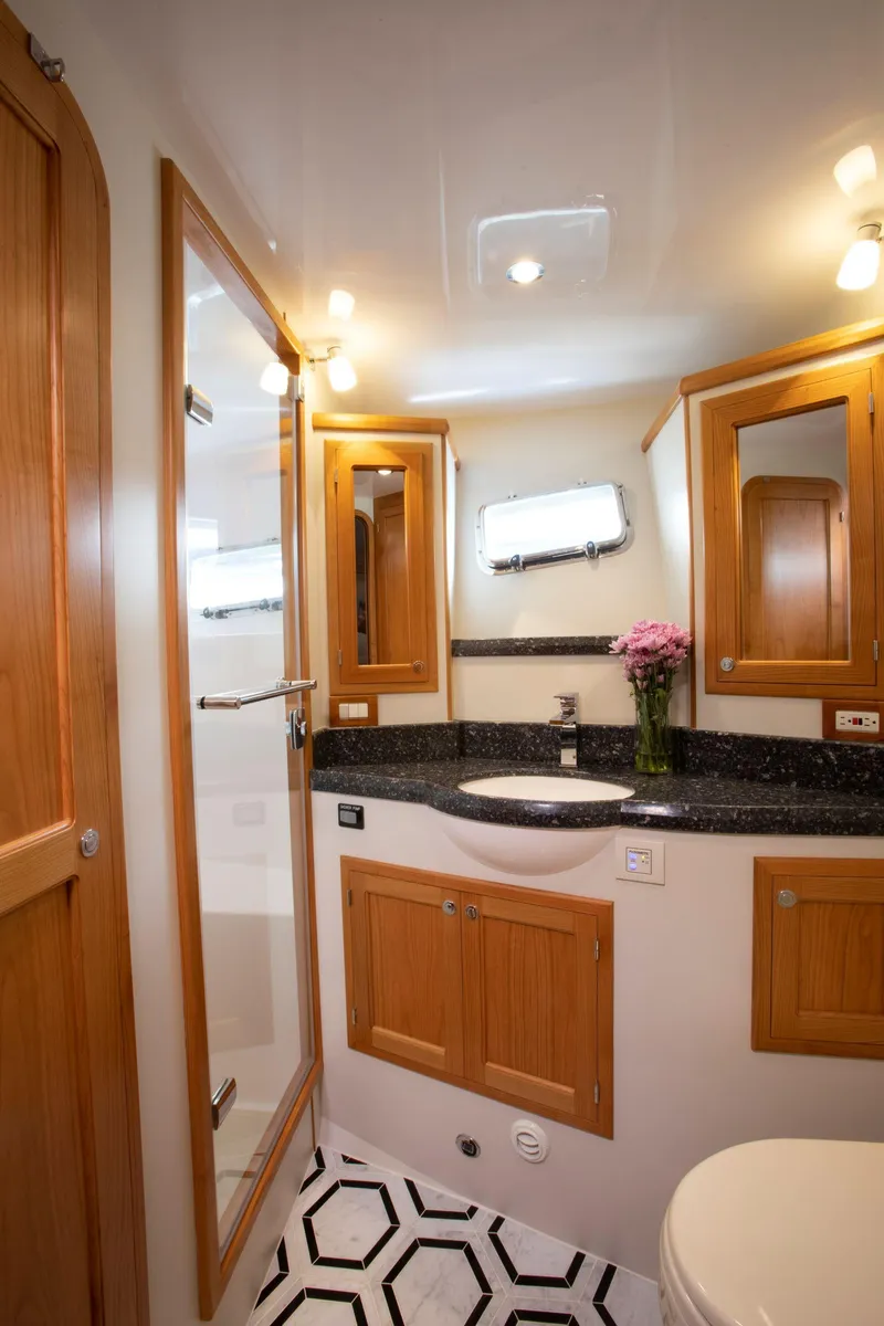 Slide: The Image of Luxurious bathroom in 2025 Krogen 58 Extended Bridge yacht with wood accents and modern fixtures. - 28