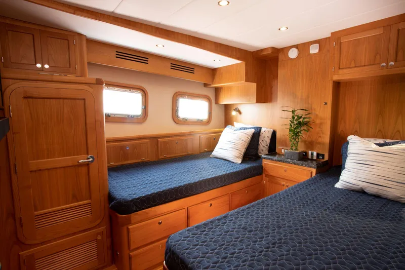 Slide: The Image of Luxurious cabin interior of 2025 Krogen 58 Extended Bridge yacht with twin beds. - 29
