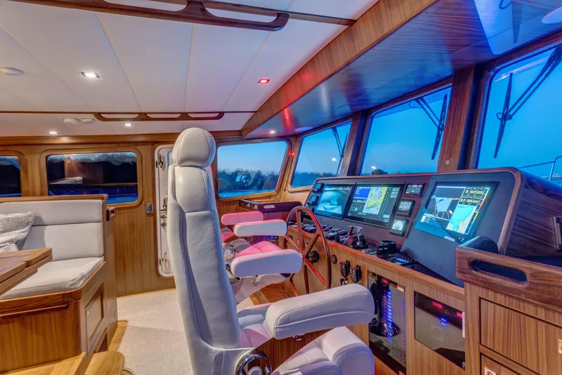 Slide: The Image of Pilothouse of 2026 Krogen 58 Extended Bridge yacht with modern navigation equipment. - 5