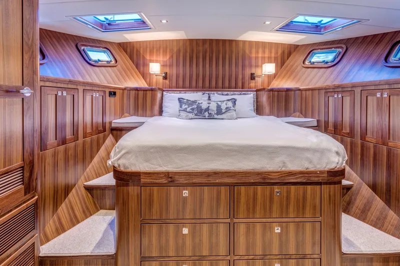 Slide: The Image of Luxurious cabin interior of 2026 Krogen 58 Extended Bridge yacht with wood paneling and skylights. - 8