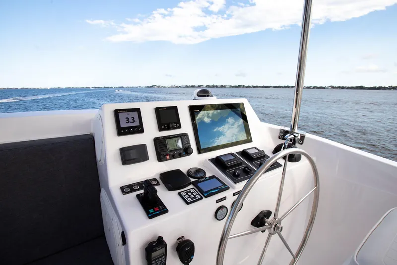 Slide: The Image of Helm of 2025 Krogen 52 yacht with advanced navigation equipment. - 3