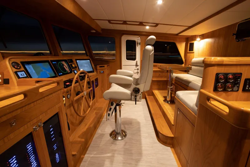 Slide: The Image of Luxurious 2025 Krogen 52 yacht interior with advanced navigation systems and plush seating. - 4
