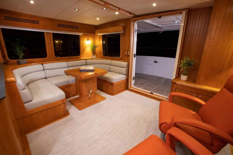 Slide: The Image of Luxurious interior of 2025 Krogen 52 yacht with cozy seating and elegant wood finishes. - 6