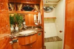Slide: The Image of Luxurious bathroom in 2004 Ocean Alexander 548 Pilothouse yacht with wood finishes and marble countertop. - 15