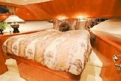 Slide: The Image of Luxurious bedroom interior of 2004 Ocean Alexander 548 Pilothouse yacht with elegant bedding. - 17