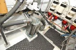 Slide: The Image of Engine room of 2004 Ocean Alexander 548 Pilothouse yacht with mechanical components. - 19