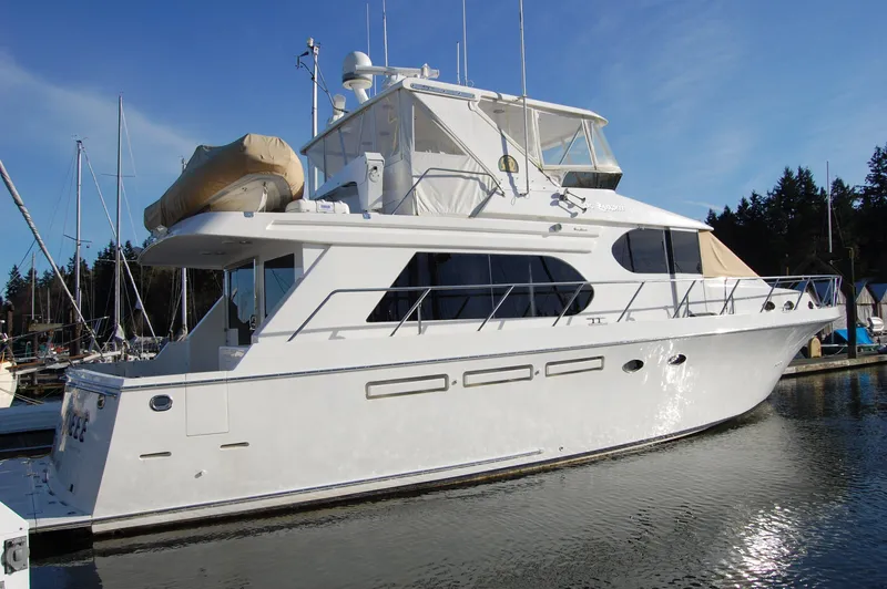 Slide: The Image of 2004 Ocean Alexander 548 Pilothouse yacht docked in a marina. - 2