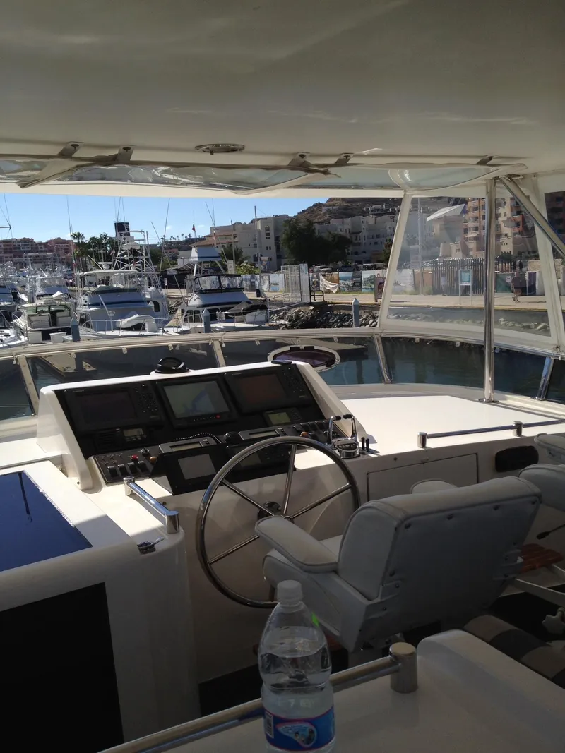Slide: The Image of 2004 Ocean Alexander 548 Pilothouse yacht interior with marina view. - 24