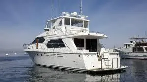 Slide: The Image of 2004 Ocean Alexander 548 Pilothouse yacht on calm waters. - 28