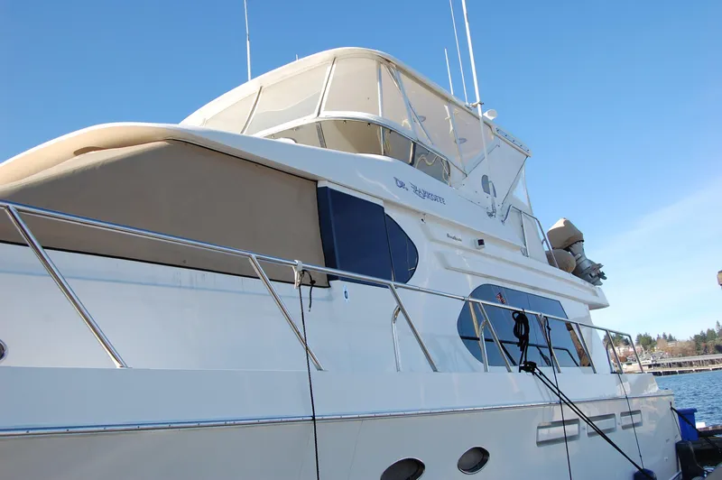 Slide: The Image of 2004 Ocean Alexander 548 Pilothouse yacht docked at marina. - 3