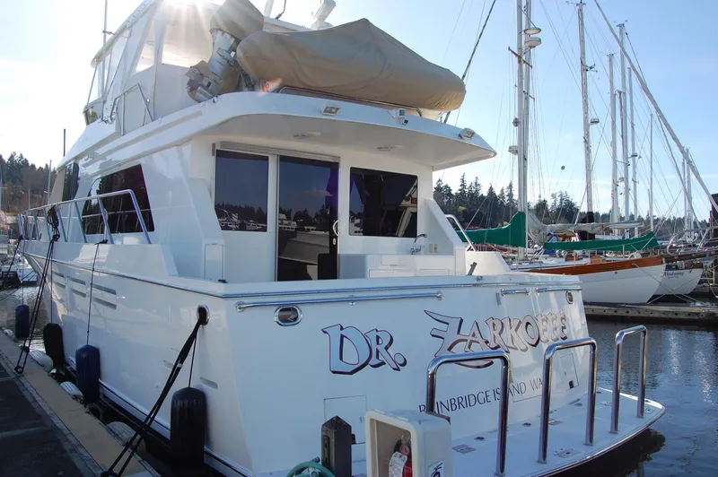 Slide: The Image of 2004 Ocean Alexander 548 Pilothouse yacht docked at marina. - 4
