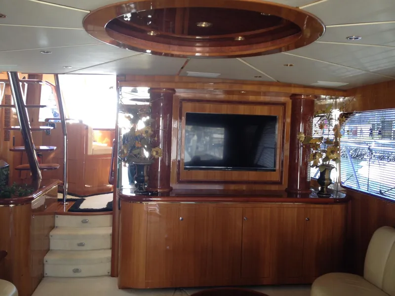 Slide: The Image of Luxurious interior of 2004 Ocean Alexander 548 Pilothouse yacht with TV and wooden finishes. - 7