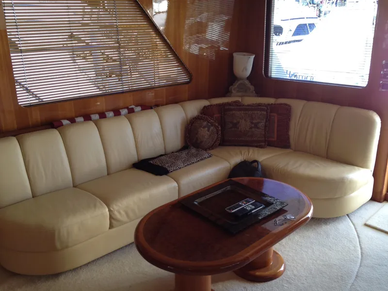 Slide: The Image of Luxurious interior of 2004 Ocean Alexander 548 Pilothouse with cream leather sofa and wooden table. - 8