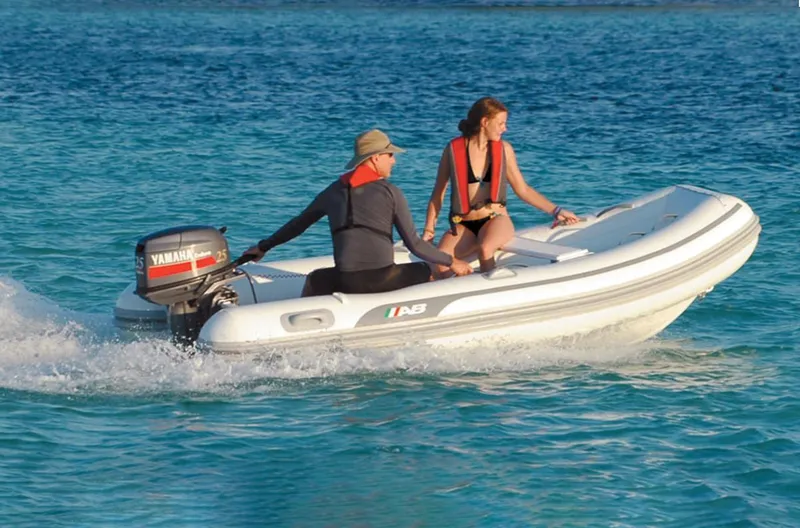 Slide: The Image of 2024 AB Inflatables Lammina 12 AL boat on water with two people. - 3