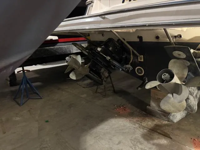 Slide: The Image of 2008 Regal 3760 boat propellers and stern drive in a storage facility. - 10
