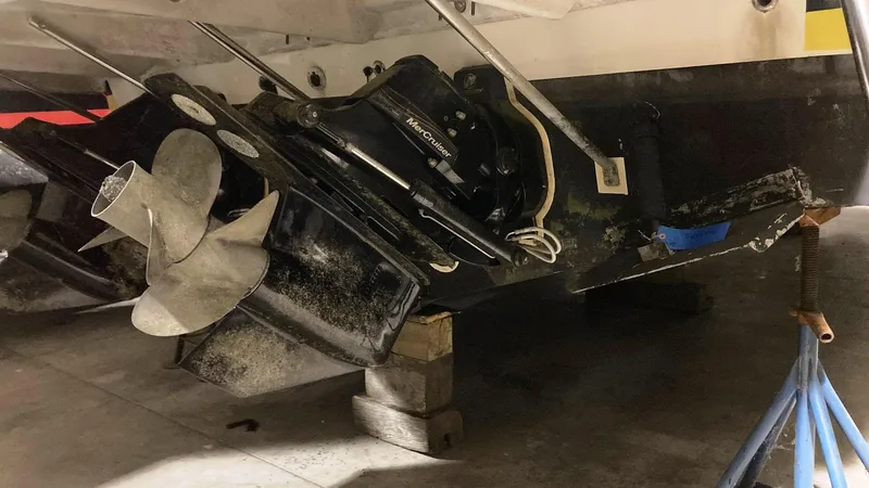 Slide: The Image of 2008 Regal 3760 boat propeller and stern drive in a maintenance area. - 11