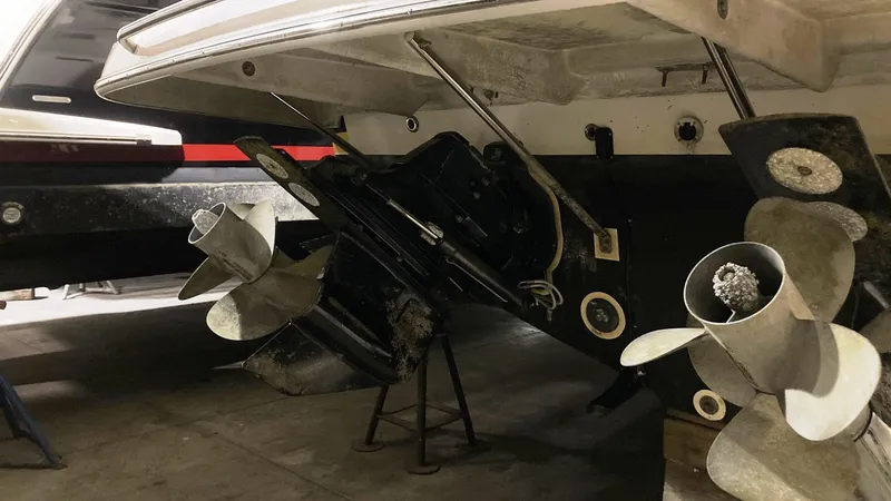 Slide: The Image of 2008 Regal 3760 boat stern with propellers in a garage. - 12