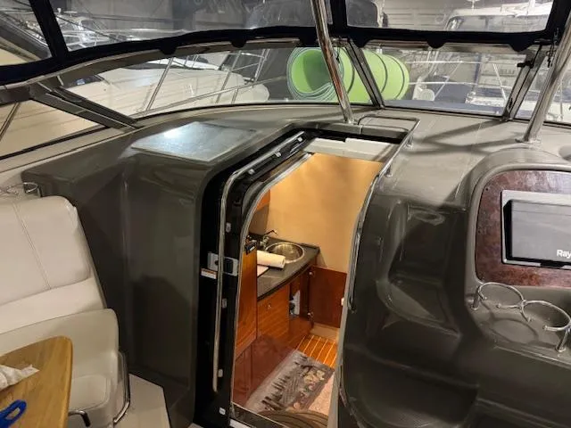 Slide: The Image of Interior of a 2008 Regal 3760 yacht showing cabin entrance and seating area. - 18