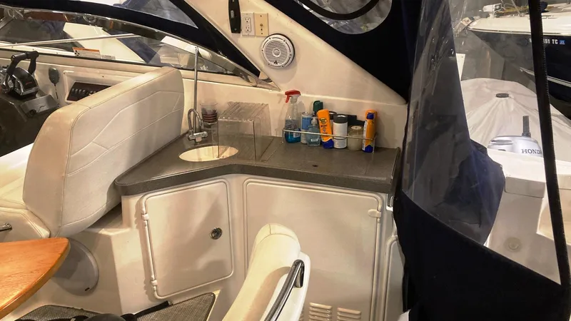 Slide: The Image of 2008 Regal 3760 boat interior with sink and storage area. - 23