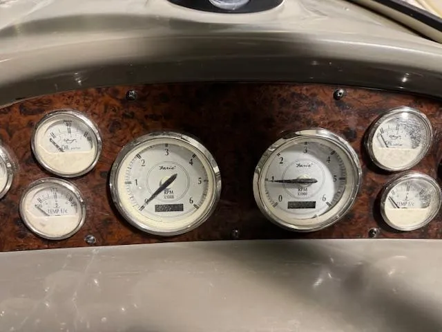 Slide: The Image of Dashboard of a 2008 Regal 3760 boat with various gauges. - 24