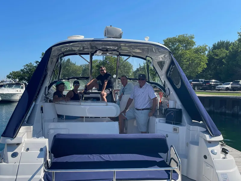 Slide: The Image of Group enjoying a day on a 2008 Regal 3760 yacht at the marina. - 4
