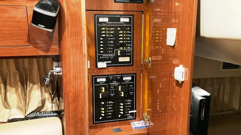 Slide: The Image of Electrical control panel inside a 2008 Regal 3760 yacht cabin. - 44