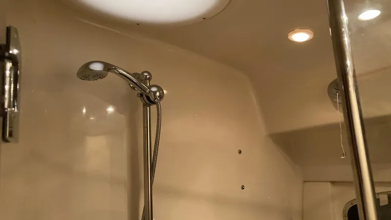 Slide: The Image of Interior shower of a 2008 Regal 3760 yacht with chrome fixtures. - 45