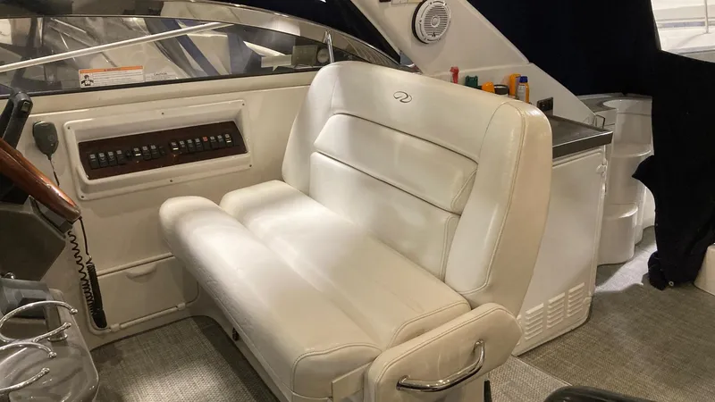 Slide: The Image of 2008 Regal 3760 boat interior with white leather seating and control panel. - 49