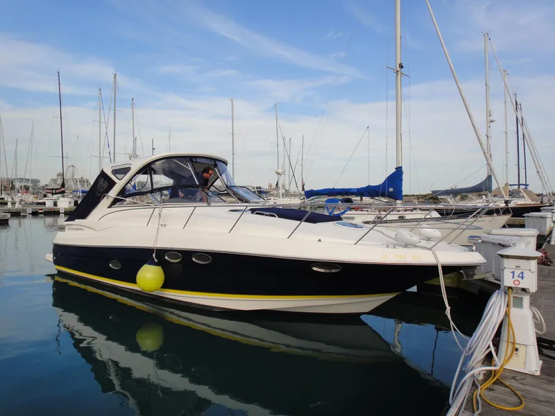 Slide: The Image of 2008 Regal 3760 yacht docked at a marina with clear skies. - 9