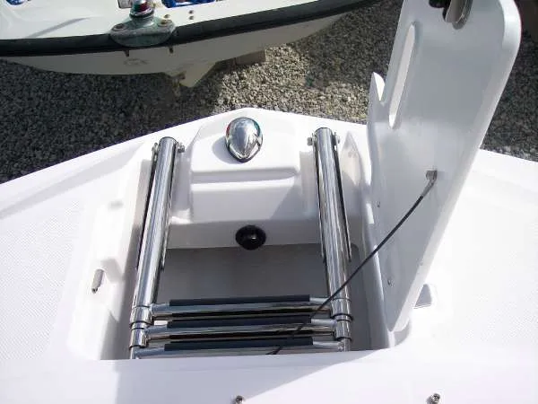 Slide: The Image of 2014 Regal 24 FasDeck boat with a retractable stainless steel ladder. - 10
