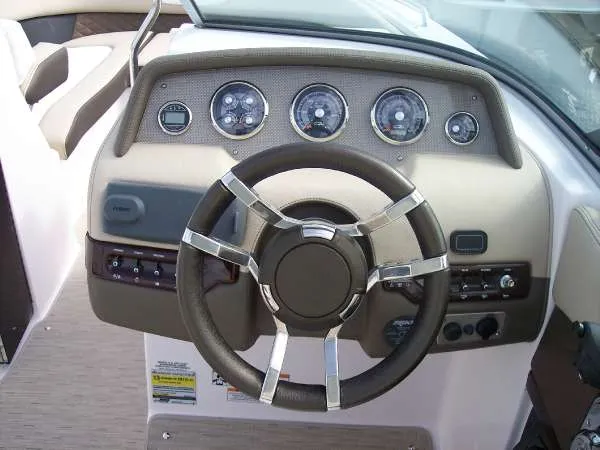Slide: The Image of Steering wheel and dashboard of 2014 Regal 24 FasDeck boat. - 14