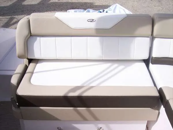 Slide: The Image of 2014 Regal 24 FasDeck boat seat with beige and white upholstery. - 20