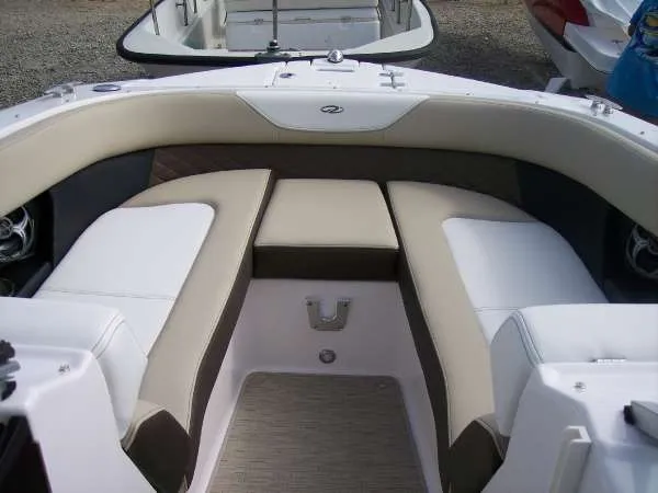 Slide: The Image of 2014 Regal 24 FasDeck boat interior with beige seating and modern design. - 5