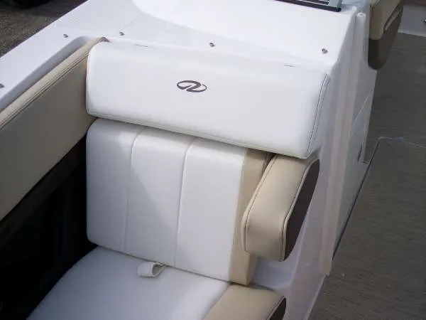 Slide: The Image of 2014 Regal 24 FasDeck boat interior with white and beige seating. - 6