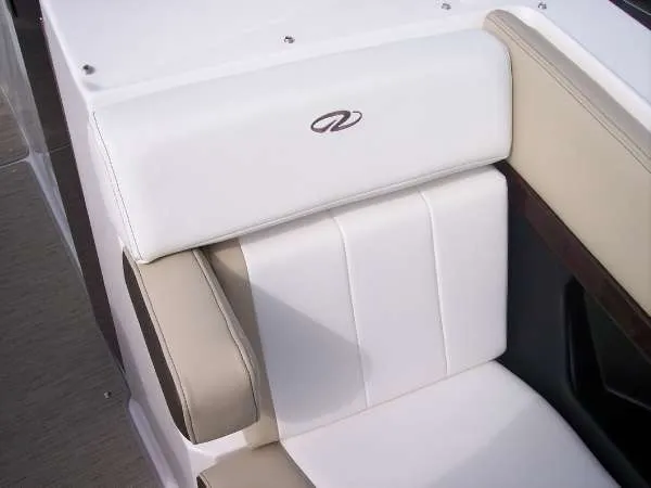 Slide: The Image of 2014 Regal 24 FasDeck boat seat with white and beige upholstery. - 7