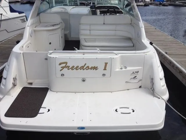 Slide: The Image of 1995 Sea Ray Sundancer 330 boat at dock, rear view. - 11