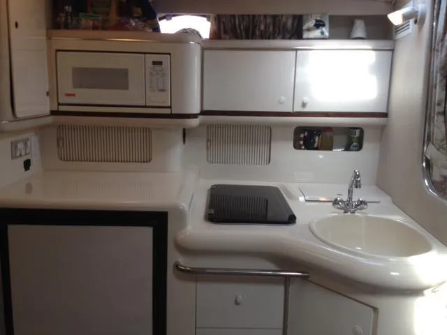 Slide: The Image of 1995 Sea Ray Sundancer 330 yacht kitchen interior. - 12