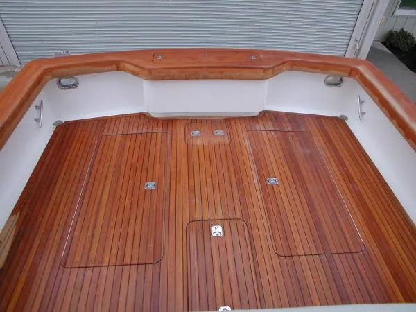 Slide: The Image of 2024 Jersey Cape Devil 36 Custom boat deck with polished wood finish. - 14