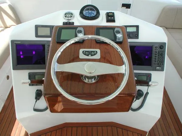 Slide: The Image of 2024 Jersey Cape Devil 36 Custom boat helm with advanced navigation instruments. - 15
