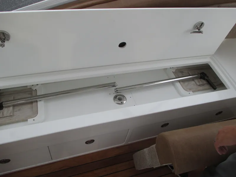 Slide: The Image of 2024 Jersey Cape Devil 36 Custom boat storage compartment with stainless steel rod holders. - 20