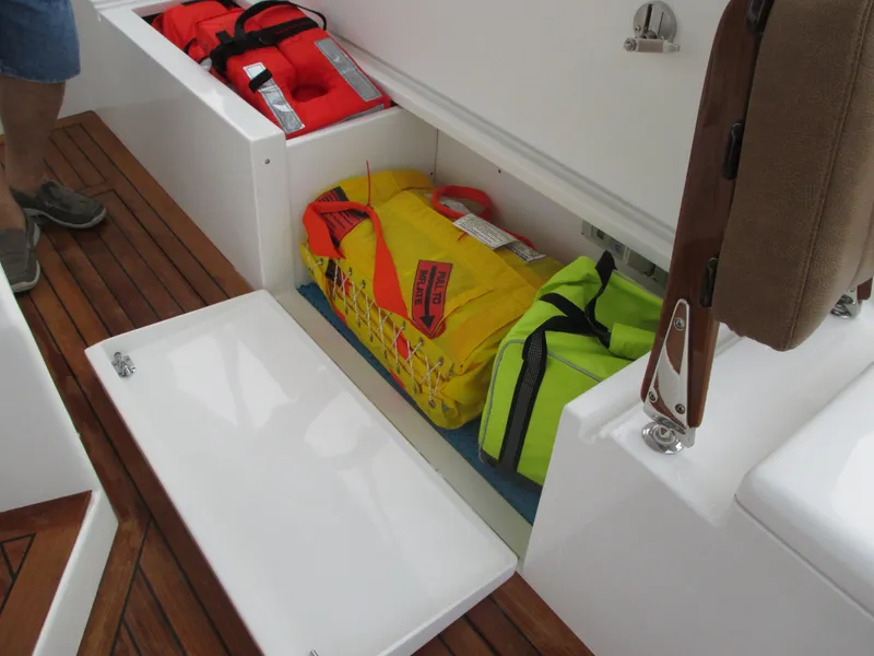 Slide: The Image of Storage compartment with safety gear on 2024 Jersey Cape Devil 36 Custom boat. - 30