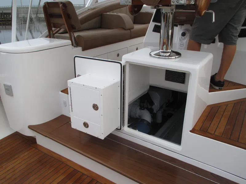 Slide: The Image of 2024 Jersey Cape Devil 36 Custom boat interior with open storage compartment. - 35