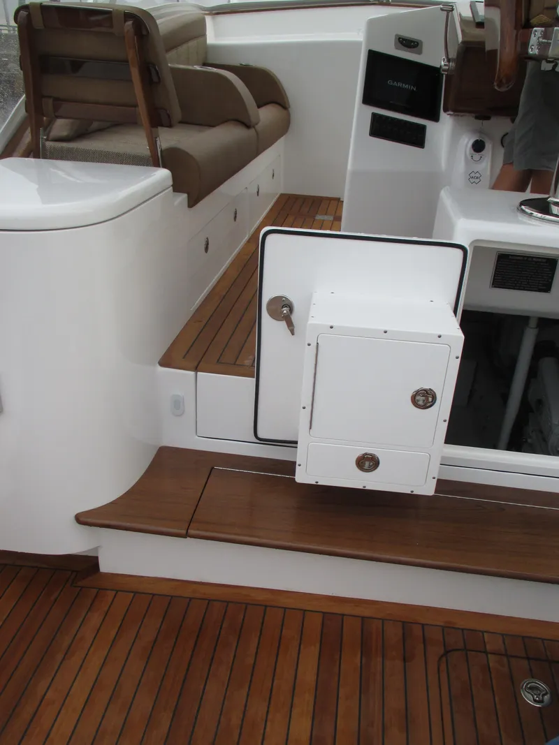 Slide: The Image of 2024 Jersey Cape Devil 36 Custom boat interior with wooden flooring and seating. - 38