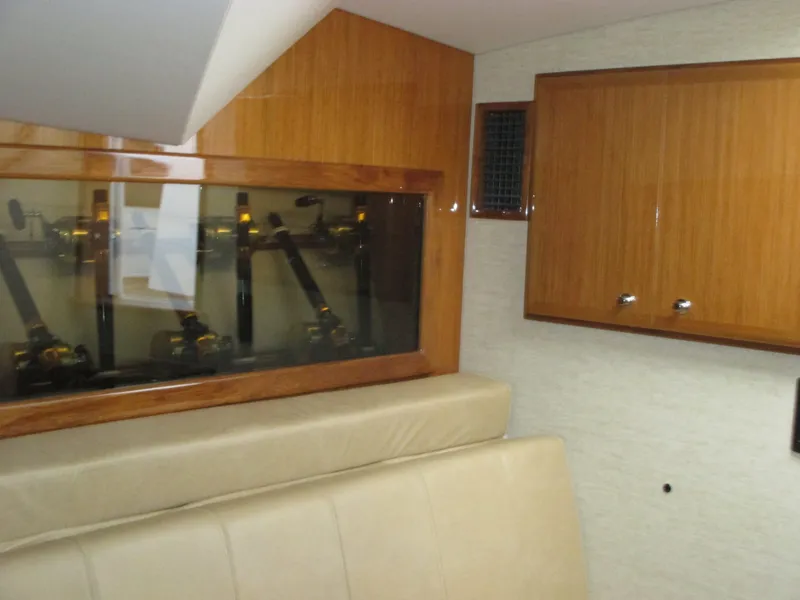 Slide: The Image of 2024 Jersey Cape Devil 36 Custom interior with wooden cabinets and leather seating. - 49