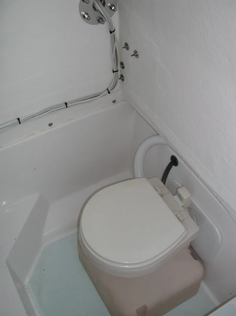 Slide: The Image of 2024 Jersey Cape 31 Little Devil boat bathroom with compact toilet - 11