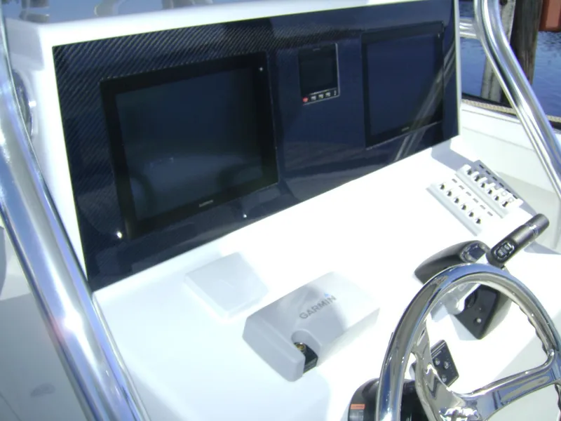 Slide: The Image of 2024 Jersey Cape 31 Little Devil boat dashboard with Garmin navigation system. - 15